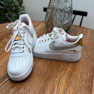 Nike Air Force 1 White with Gold and Silver Accents.  Nola 504